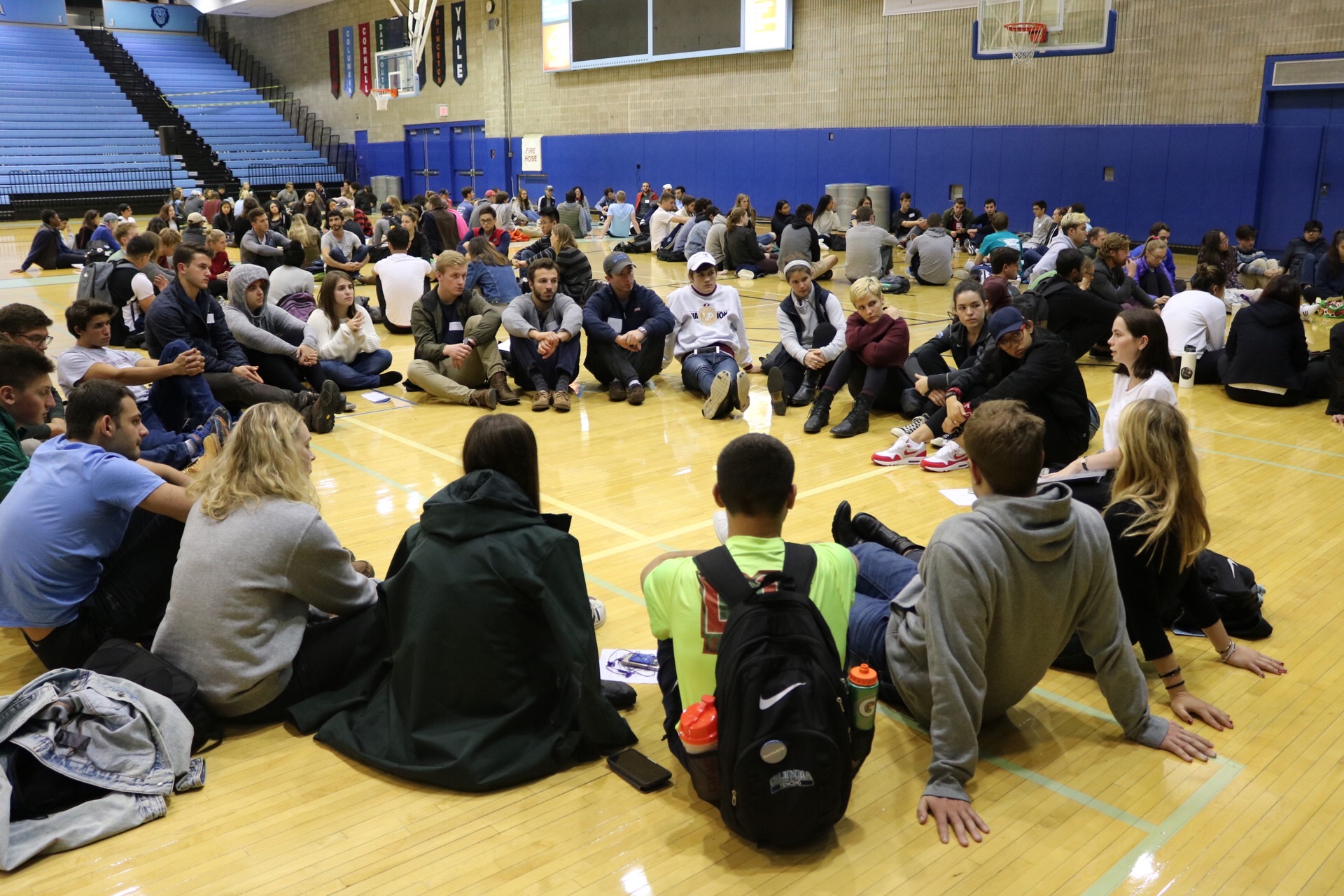 Students sitting in a circle during a workshop.